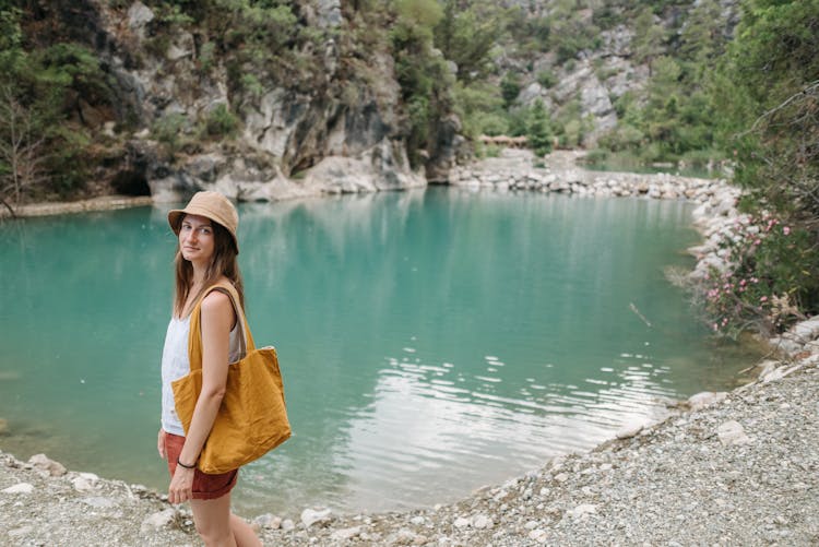 A Woman Standing Near The Lake