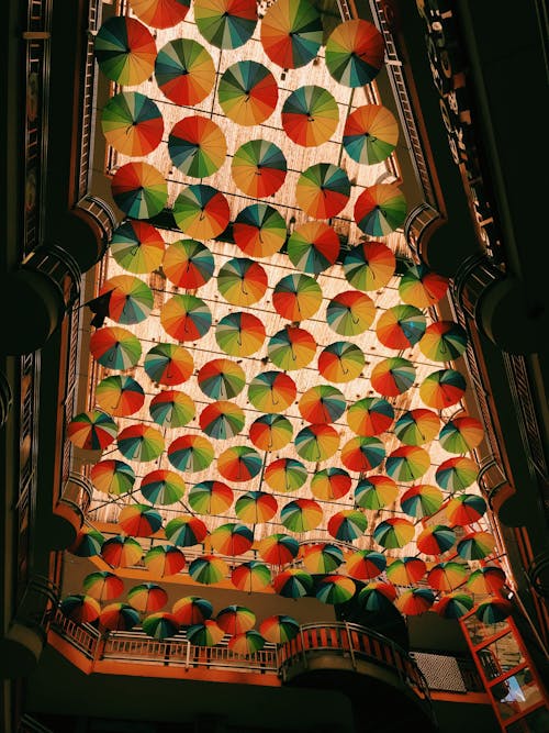 Colorful Umbrellas over Building