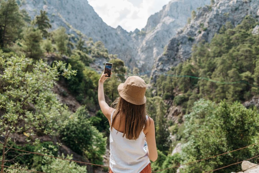 Phone, tablet, smartwatch and tech accessories laid out flat