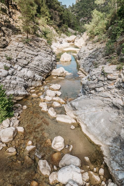 Stream Between Two Rocks A Stream between Rock Formations · Free Stock Photo
