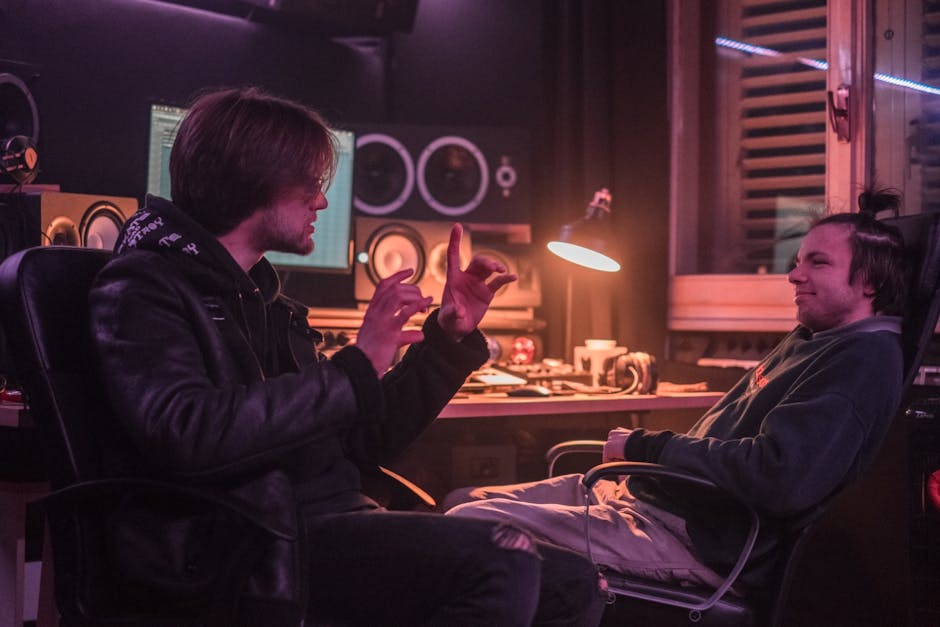 Top Smart Speaker Sound Quality Rankings for 2025: Ultimate Guide Two men discussing in a recording studio, showcasing creative collaboration indoors.