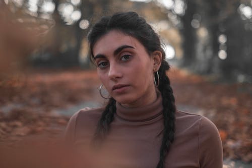 Close-Up Shot of a Pretty Woman in Brown Turtleneck Sleeves