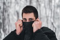 A Man in Black Sweater and Jacket