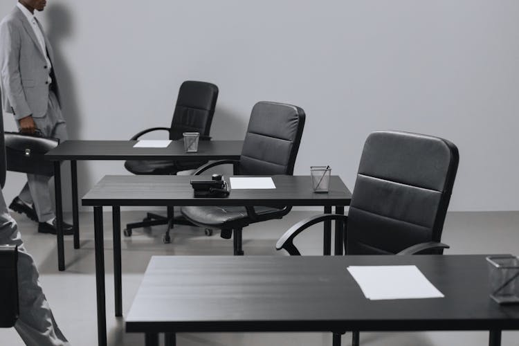 Black Armchairs And Desks In The Office