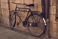 Black City Bicycle Leaning on Wall