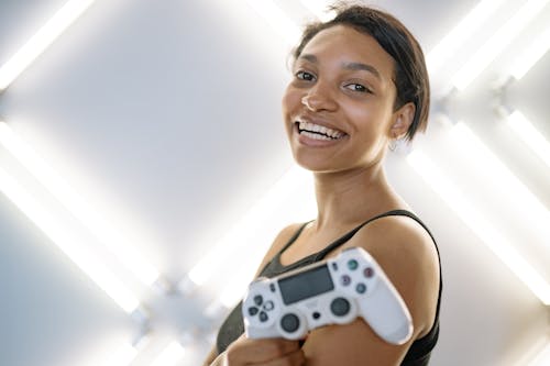 Close-Up Shot of a Woman Holding a Game Controller 