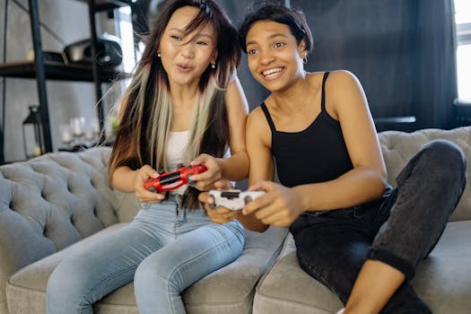 Two women playing video games together, smiling and having fun indoors.