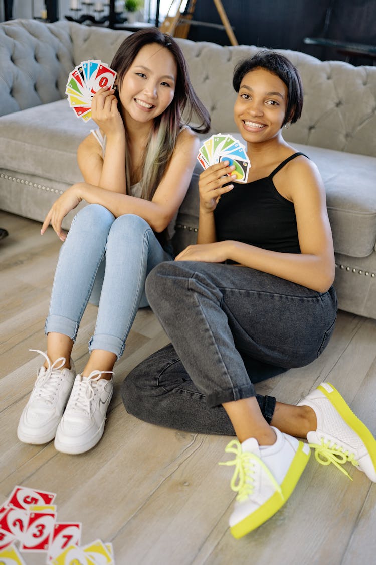 Two Women Playing Uno Cards