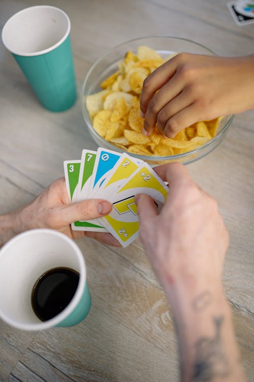 Person Holding Uno Cards