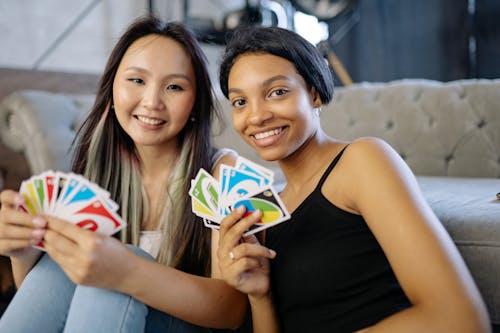 Free Two Women Playing Uno Cards Stock Photo