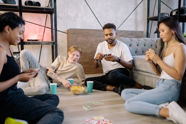 People Playing A Card Game 