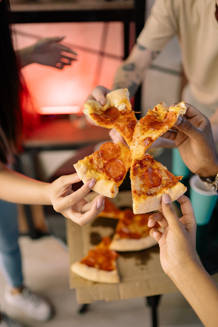 Friends Eating Pizza In The Room