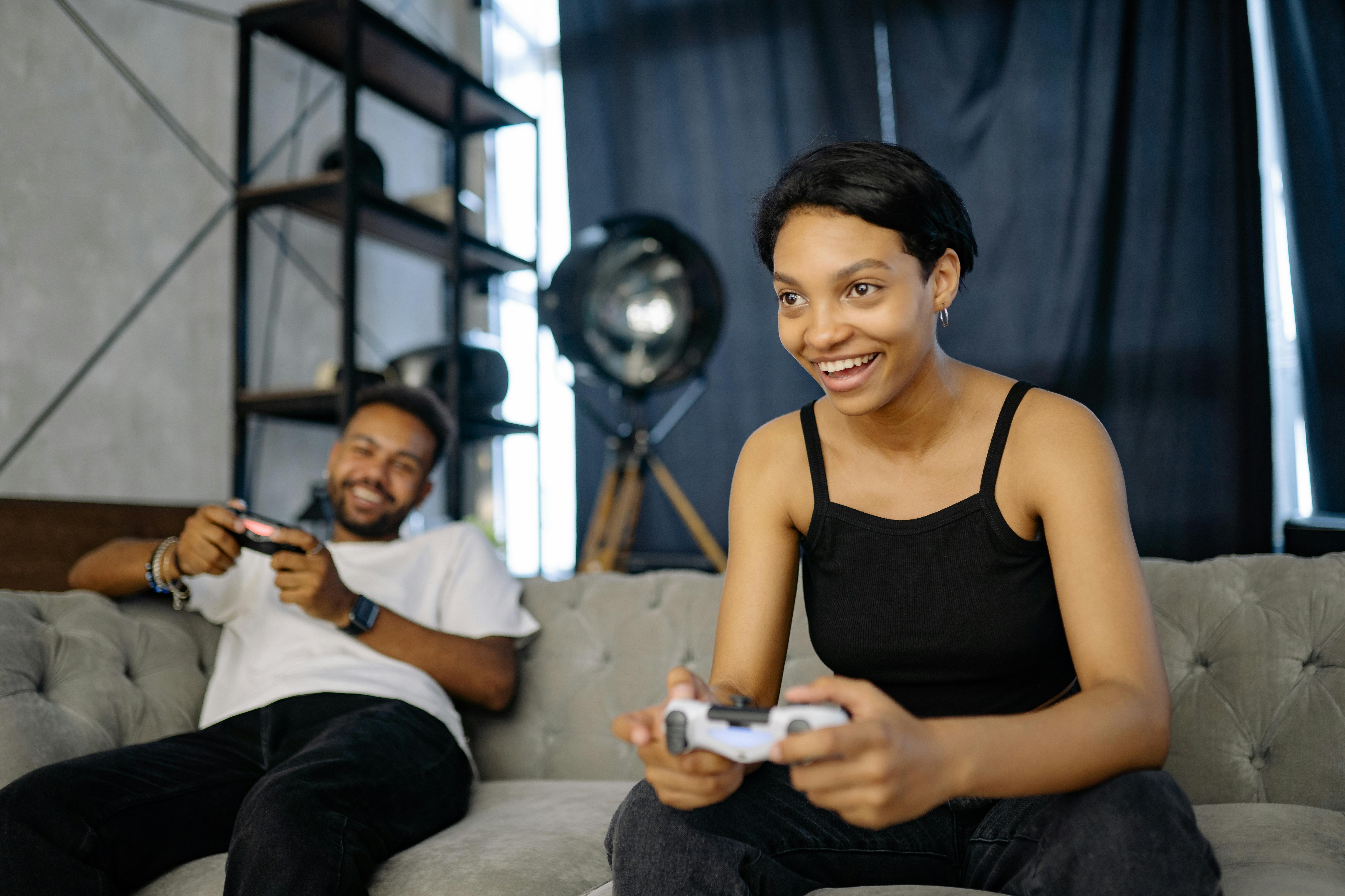 50+ Man Playing Video Game With Girlfriend Who Lying On The Sofa Stock  Photos, Pictures & Royalty-Free Images - iStock
