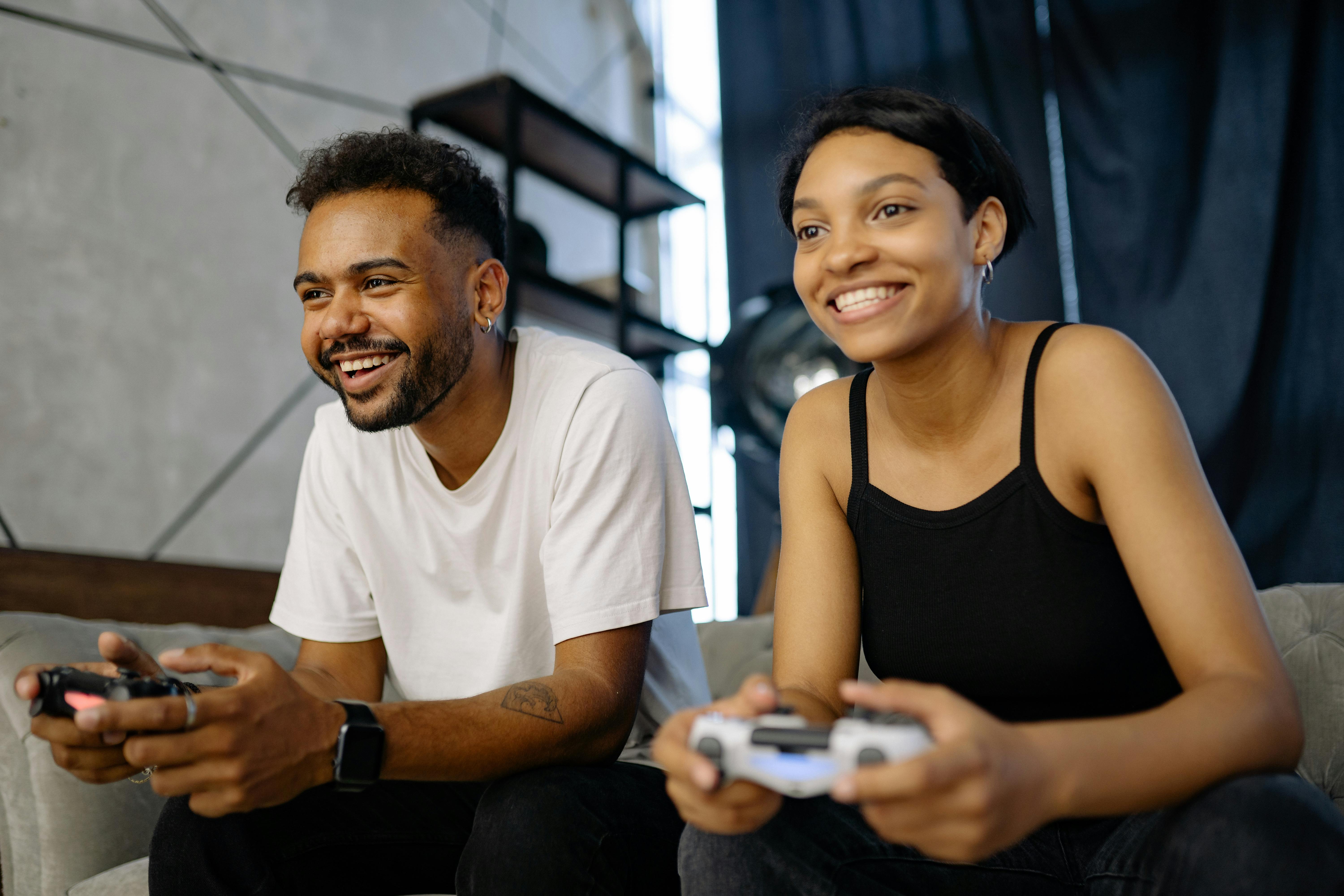 Man And Woman Playing Video Games Stock Photo