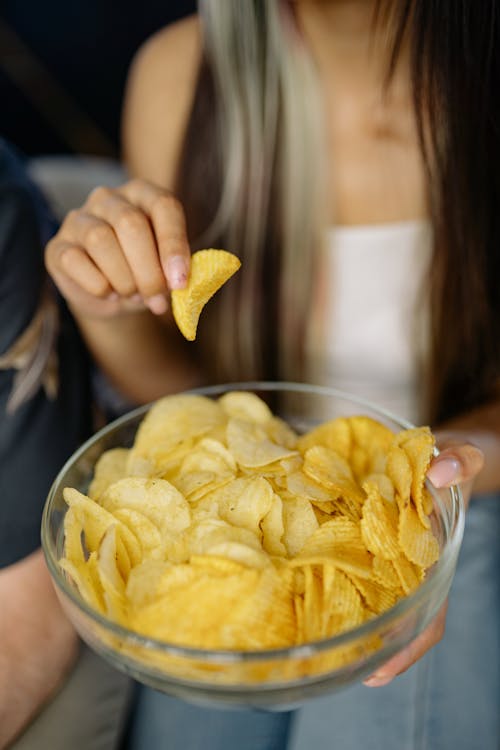 Free Selective Focus Photo of a Glass Bowl with Chips Stock Photo