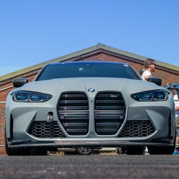 Front view of a luxury BMW sports car parked outdoors in England.