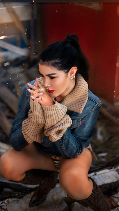 A Beautiful Woman in Denim Jacket with Her Hands Together