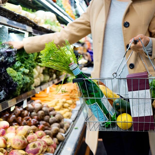 Shopper choosing fresh produce with a basket — photo by Tara Clark on Pexels