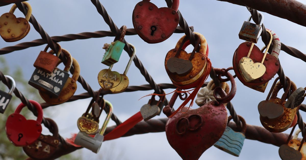 Assorted Padlocks Assorted Padlocks Hanging on Metal Grill · Free Stock Photo