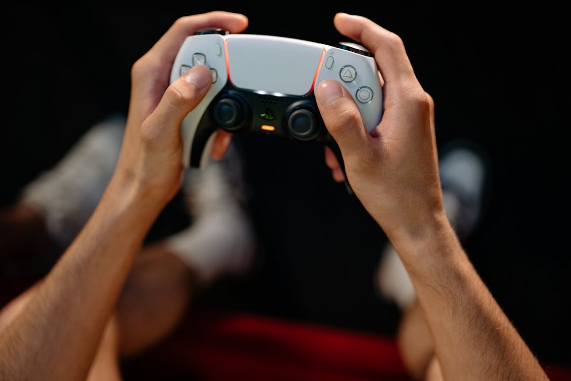 A Person Holding a Game Controller 