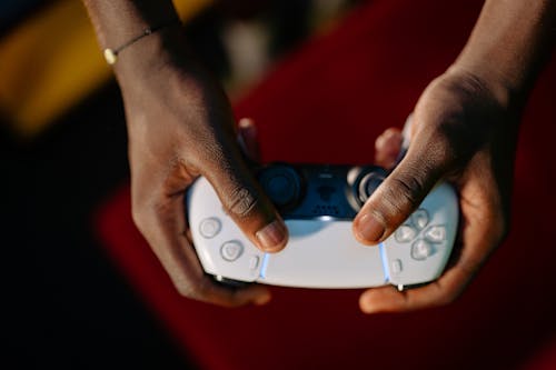 Free A Person Holding a Game Controller Stock Photo