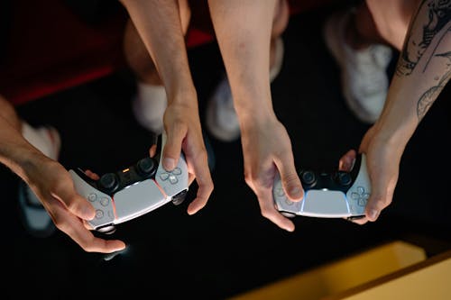 People Holding Game Controllers