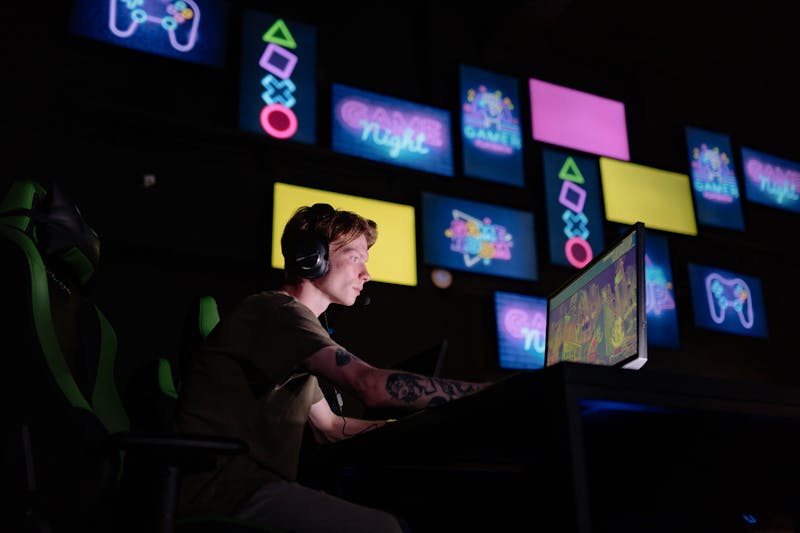 Gamer in neon-lit competitive gaming environment