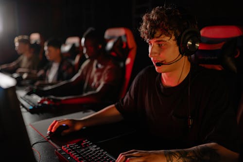 Free A Man Looking Serious in Playing a Video Game Stock Photo