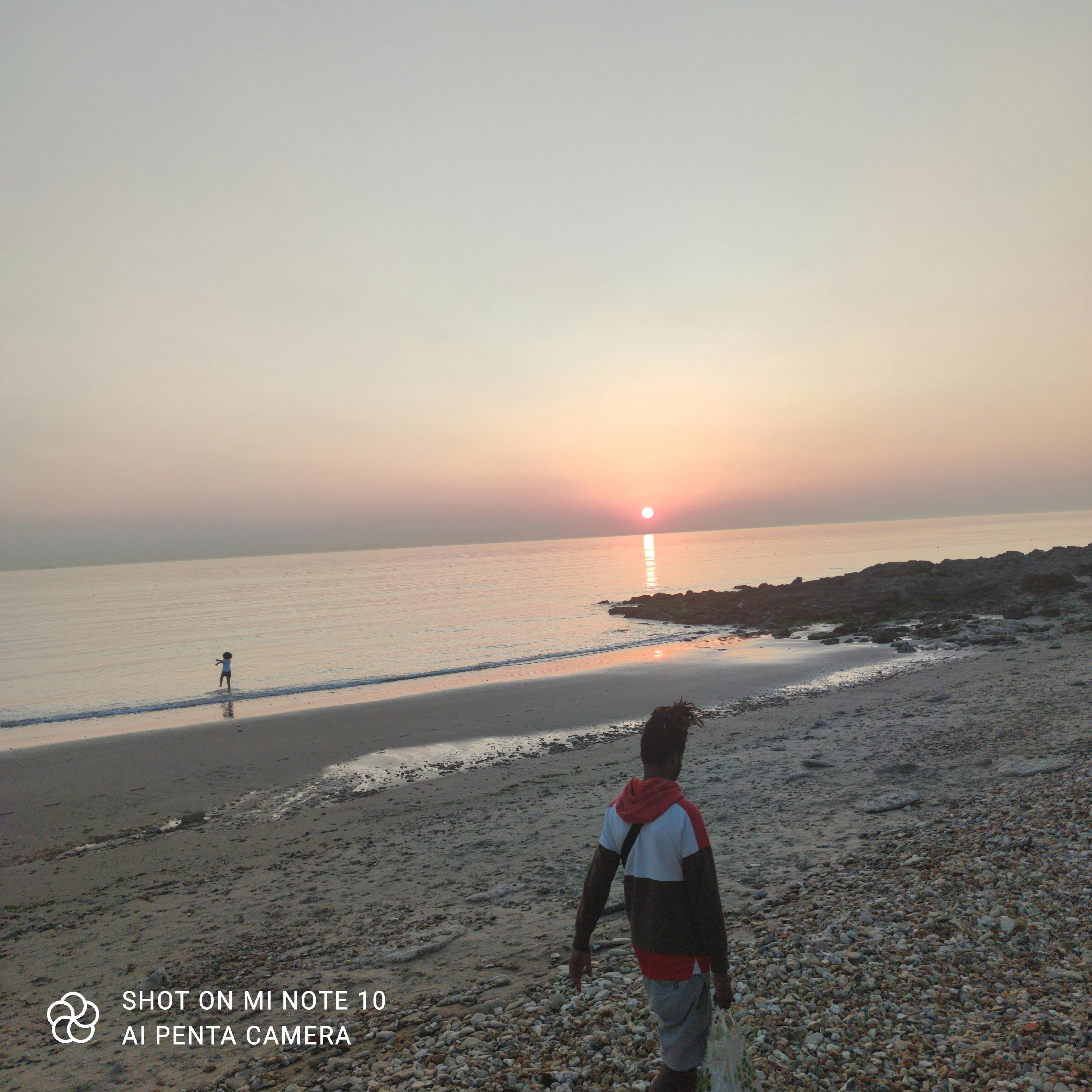 Team huddle on a cricket field before the start of play