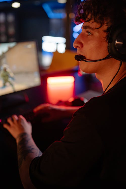 Man Wearing Headset While Playing Online Games 