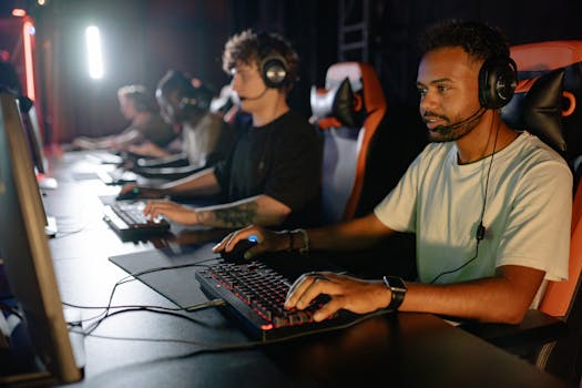 A group of young men immersed in a competitive esports gaming session indoors.