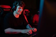 Man in Black Crew Neck T-shirt Using Black Computer Keyboard