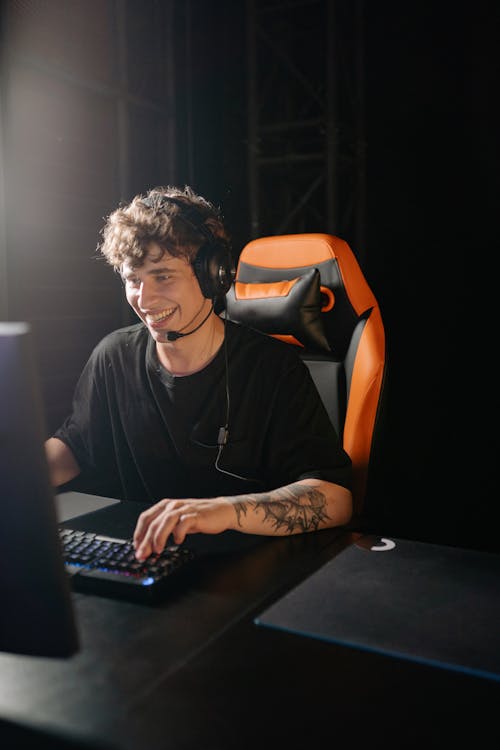Smiling Man Playing PC Game