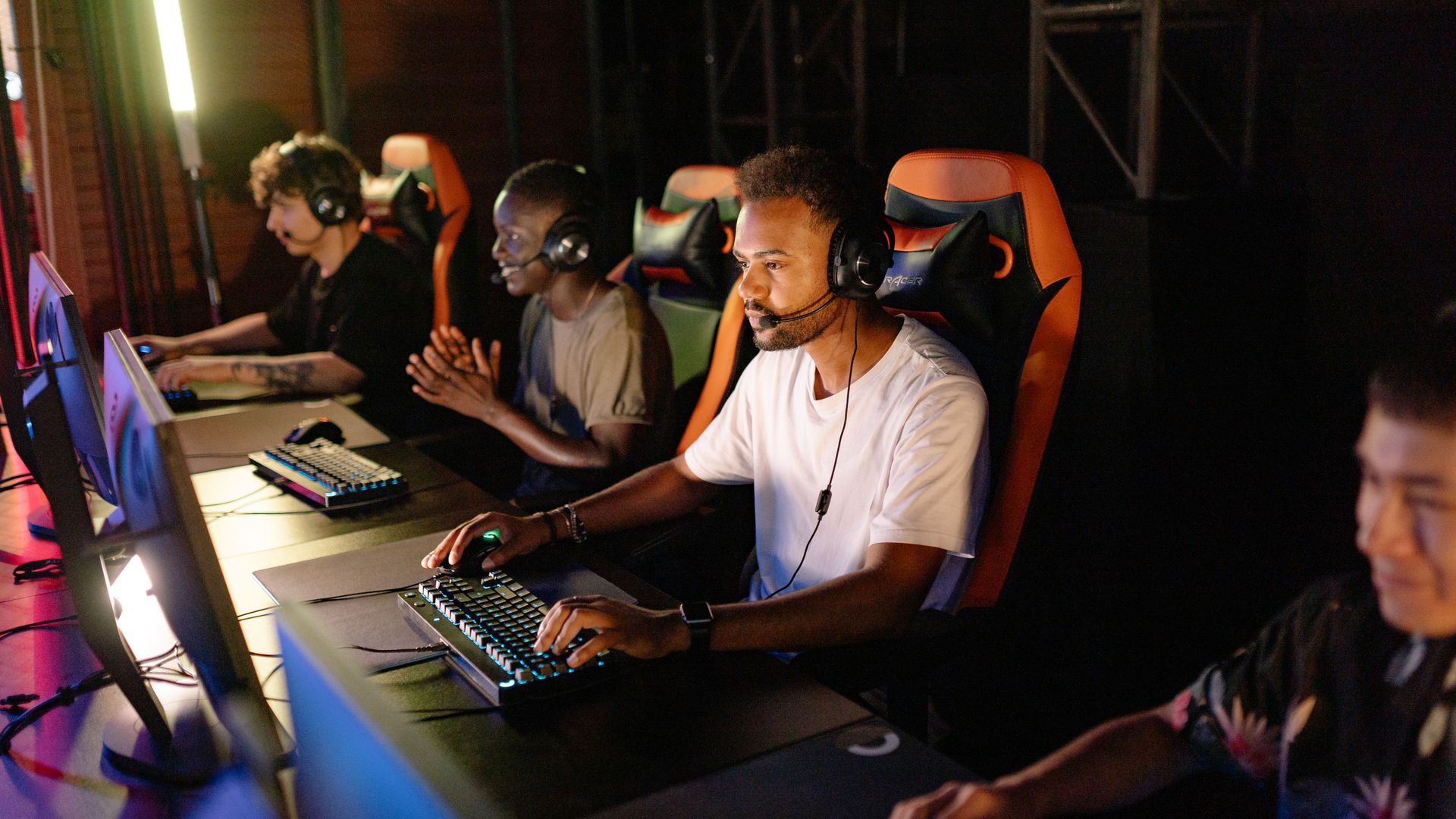 Modafinil for Esports Players: Enhancing Performance A group of young adults intensely focused on a competitive esports tournament indoors — modafinil for esports players