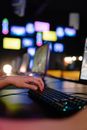 Selective Focus Photograph of a Person's Hand Typing on a Keyboard