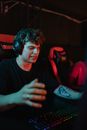 Photo of a Man with a Headset Showing Frustration