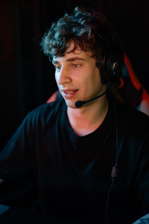 Young broadcaster with a headset at a desk — photo by Yan Krukau on Pexels