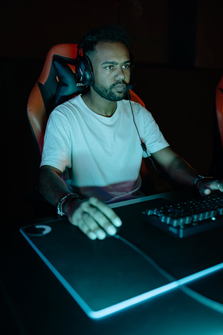 A Man Playing A Video Game In A Computer