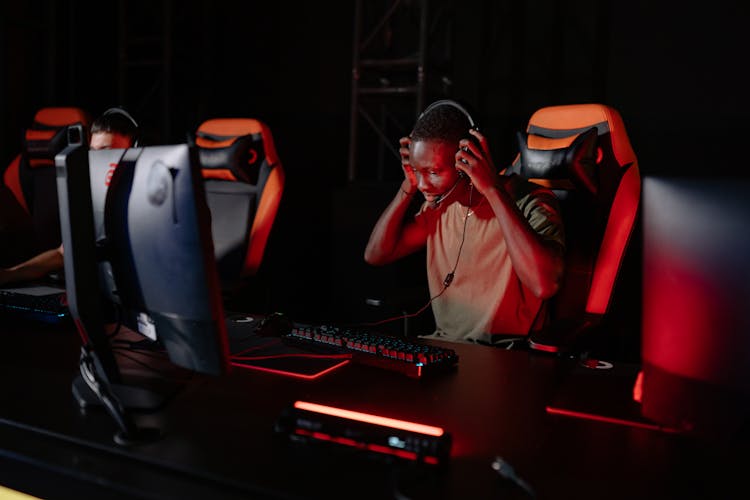 Man Sitting In Front Of A Computer