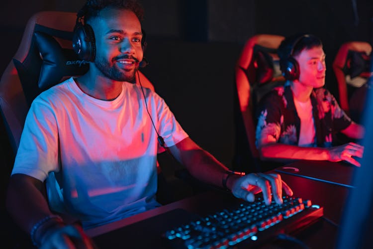 Men Gaming In An Internet Cafe