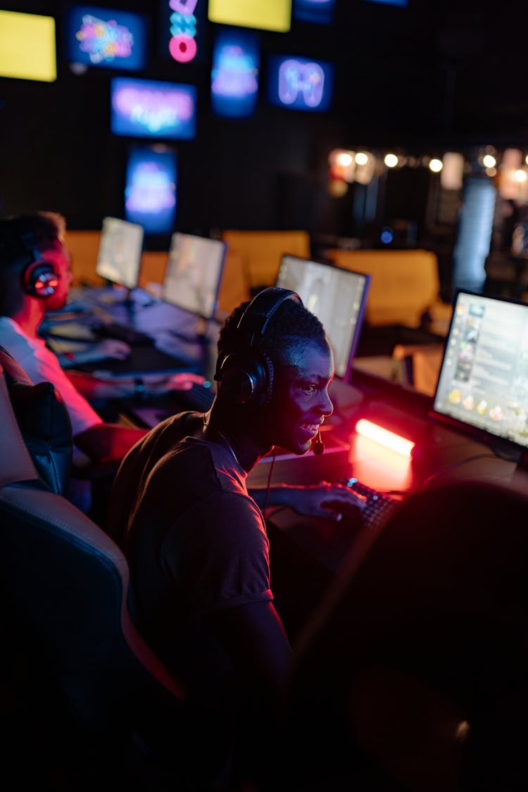 A Man Gaming In A Cybercafe