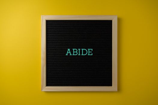 Wooden Framed Text Board on Yellow Background