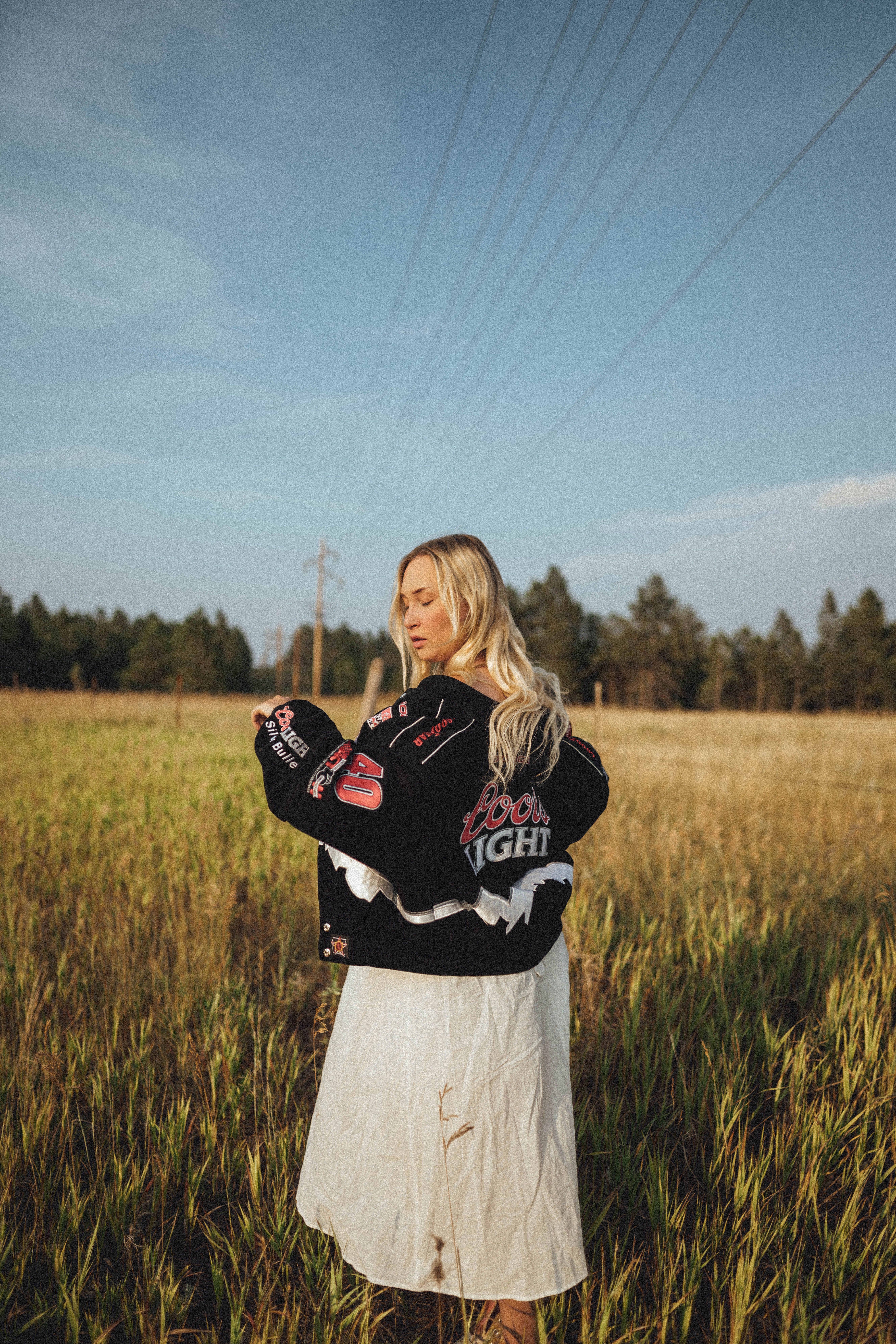 Woman Wearing Black Jacket standing on Grass Field · Free Stock Photo