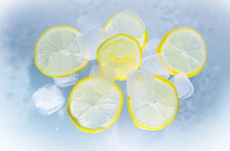 Sliced Lemon On Ice Water