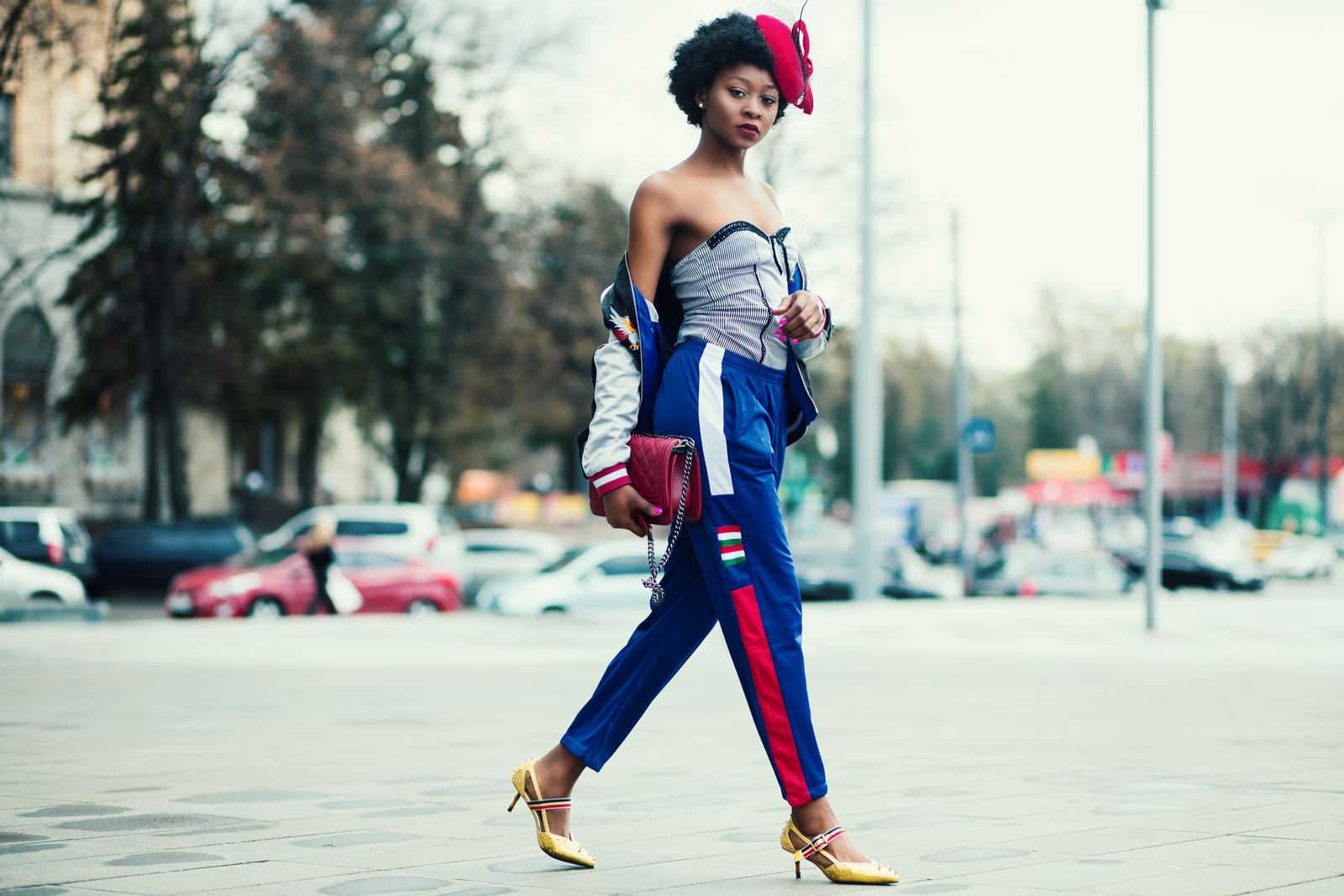 Stylish woman walking confidently in cityscape