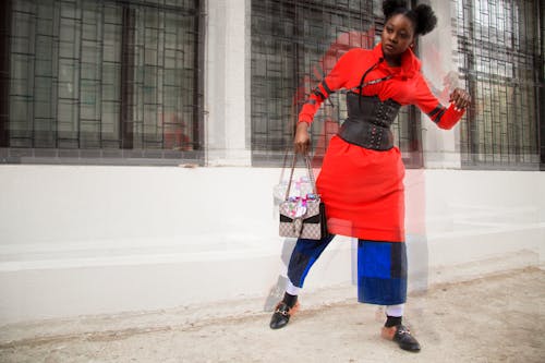 Free Woman in Red and Multicolored Shirt Dress Holding Bag Stock Photo