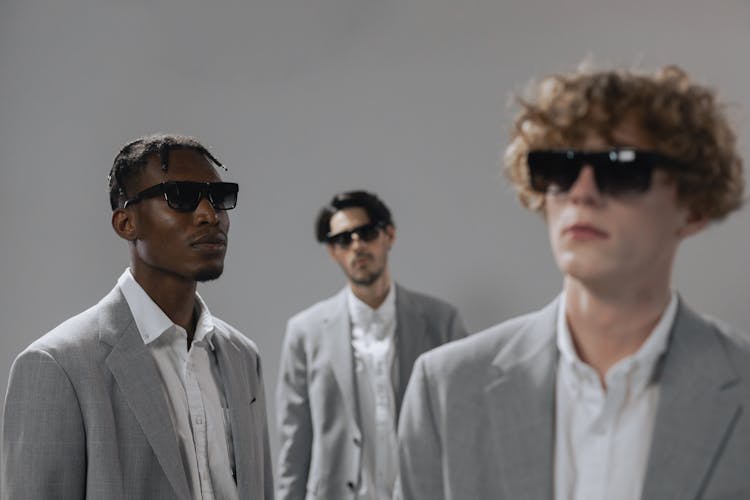 Men In Gray Suit Wearing Sunglasses