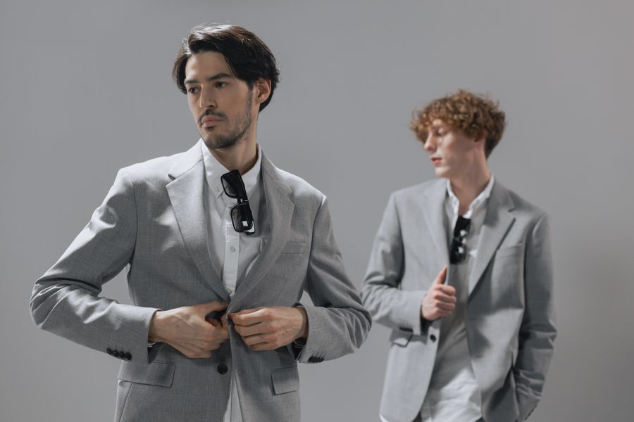 Two men in tailored suits in a bright studio &mdash; photo by cottonbro studio on Pexels