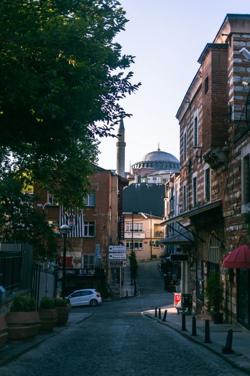 Free Scenic street view in Istanbul showing traditional architecture and Hagia Sophia's dome. Stock Photo