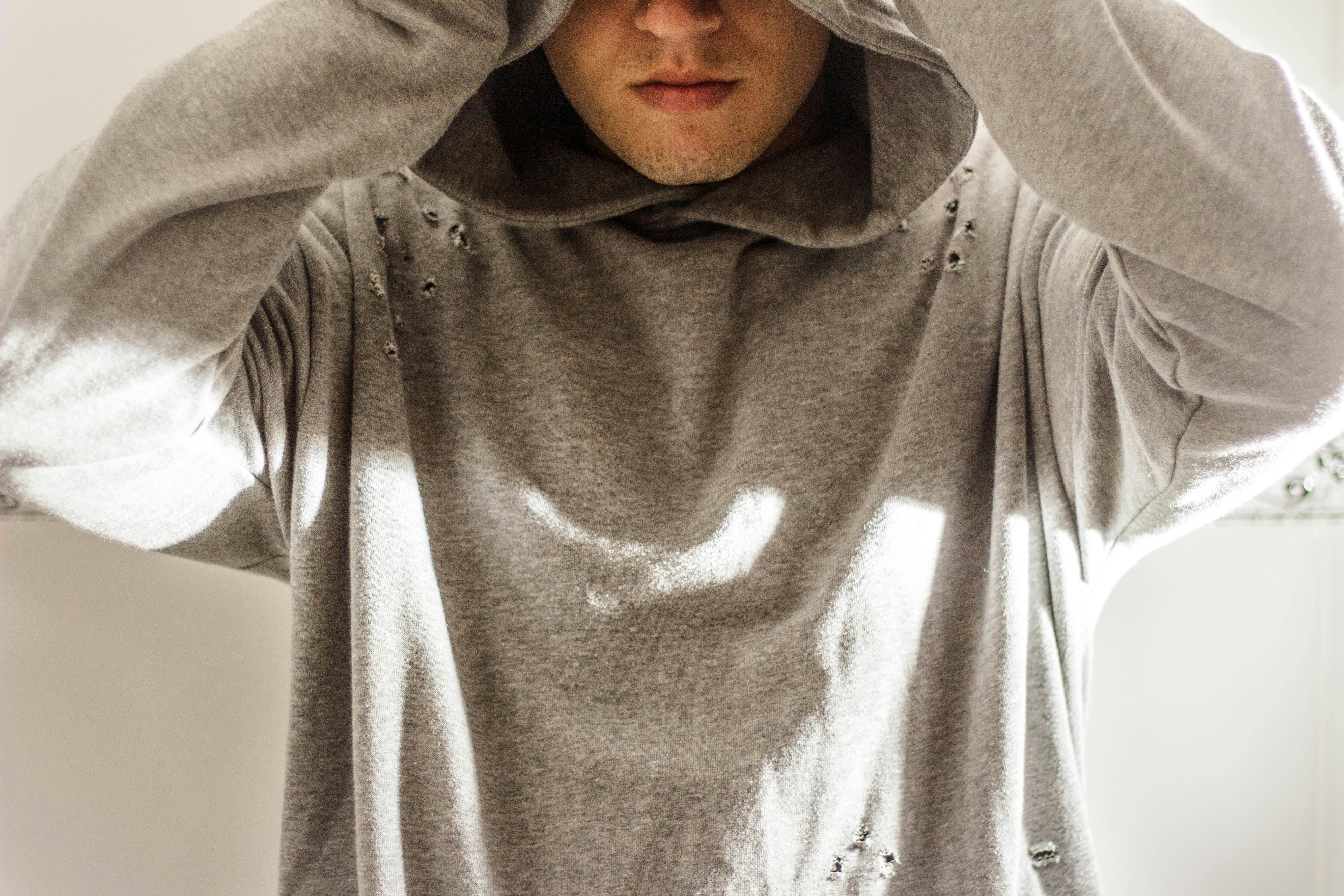 man wearing gray hoodie